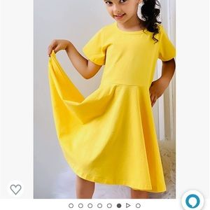 A lime yellow girls dress, never worn, size 10